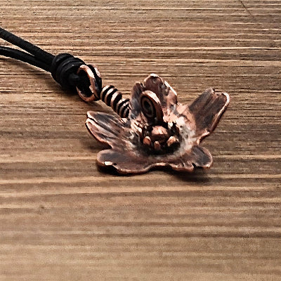 Handmade Copper Wall Flower Pendant with Wire wrap on a black leather cord close view