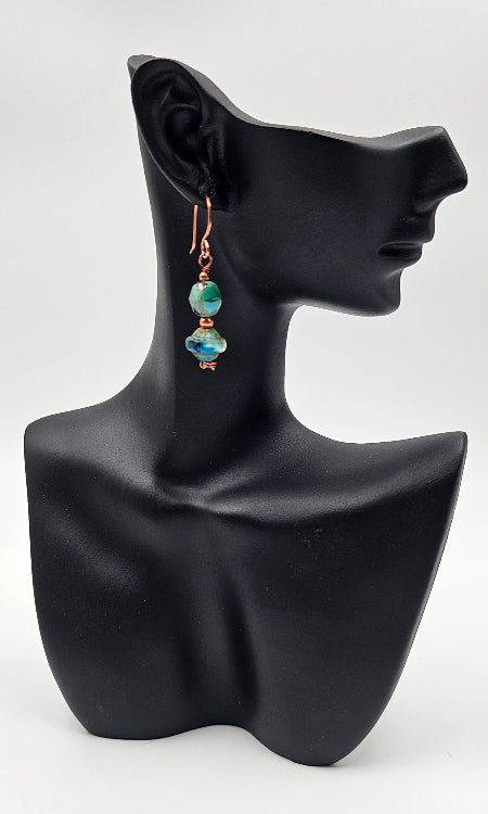 Handmade Copper and Czech Glass Saturn Seas drops on a ceramic head