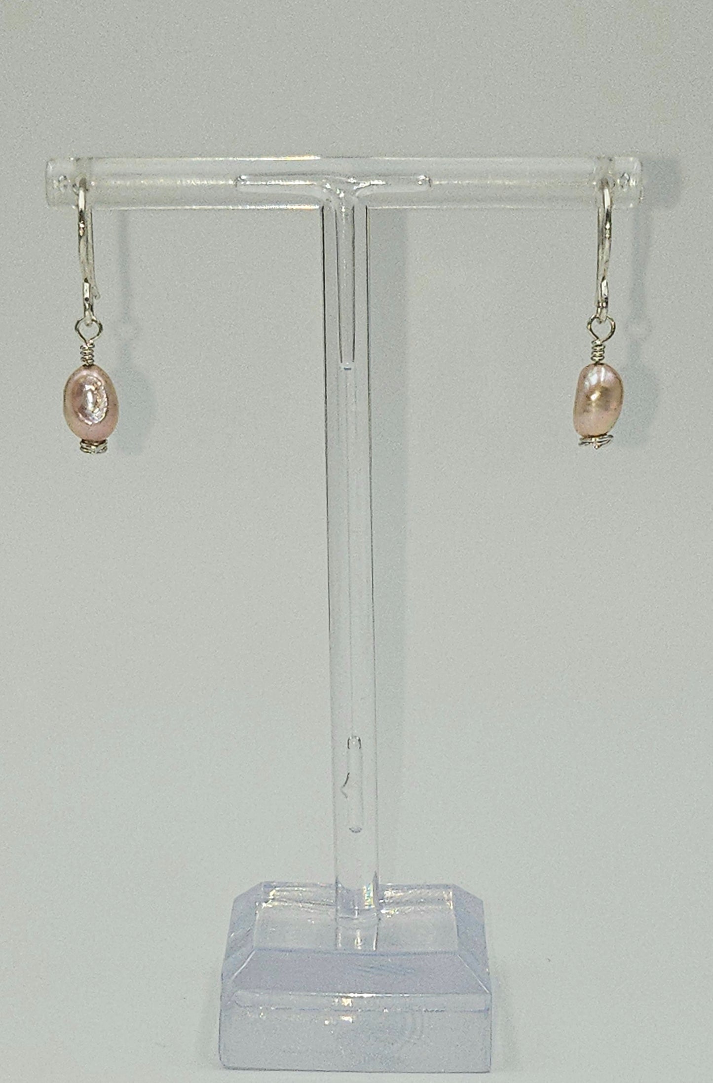 Handmade Sterling Silver Pink Freshwater Pearl earrings on stand