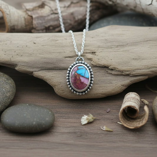 Sterling Silver and Spiny Oyster pendant on driftwood