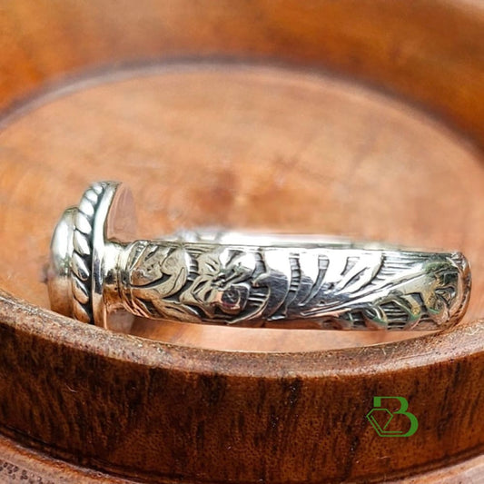 Sterling Silver Bandit's Mine Ring with Floral Band Close-Up against wooden background