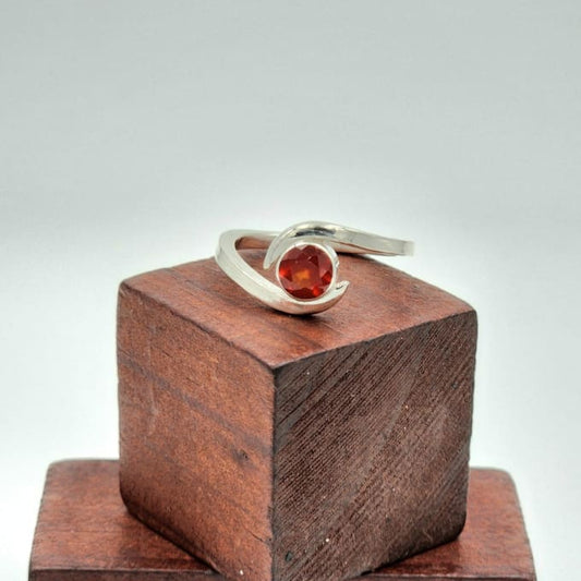 Sterling Silver Hessonite Garnet Bypass Ring on Wooden Display Blocks