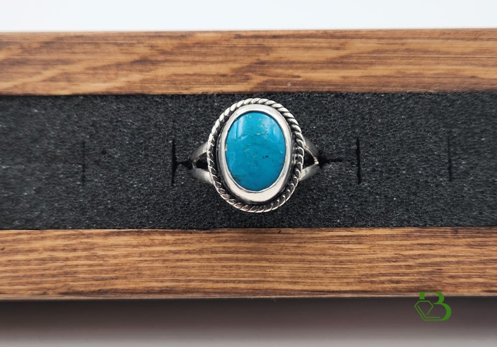 Picture of the Sleeping Beauty Turquoise Rope Ring in the Wooden Display