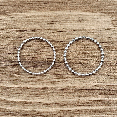 2 beaded stacker rings skown side by side on wood 