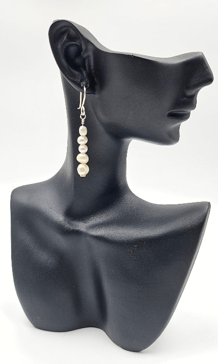 Freshwater Cream Pearl earrings on ceramic head 