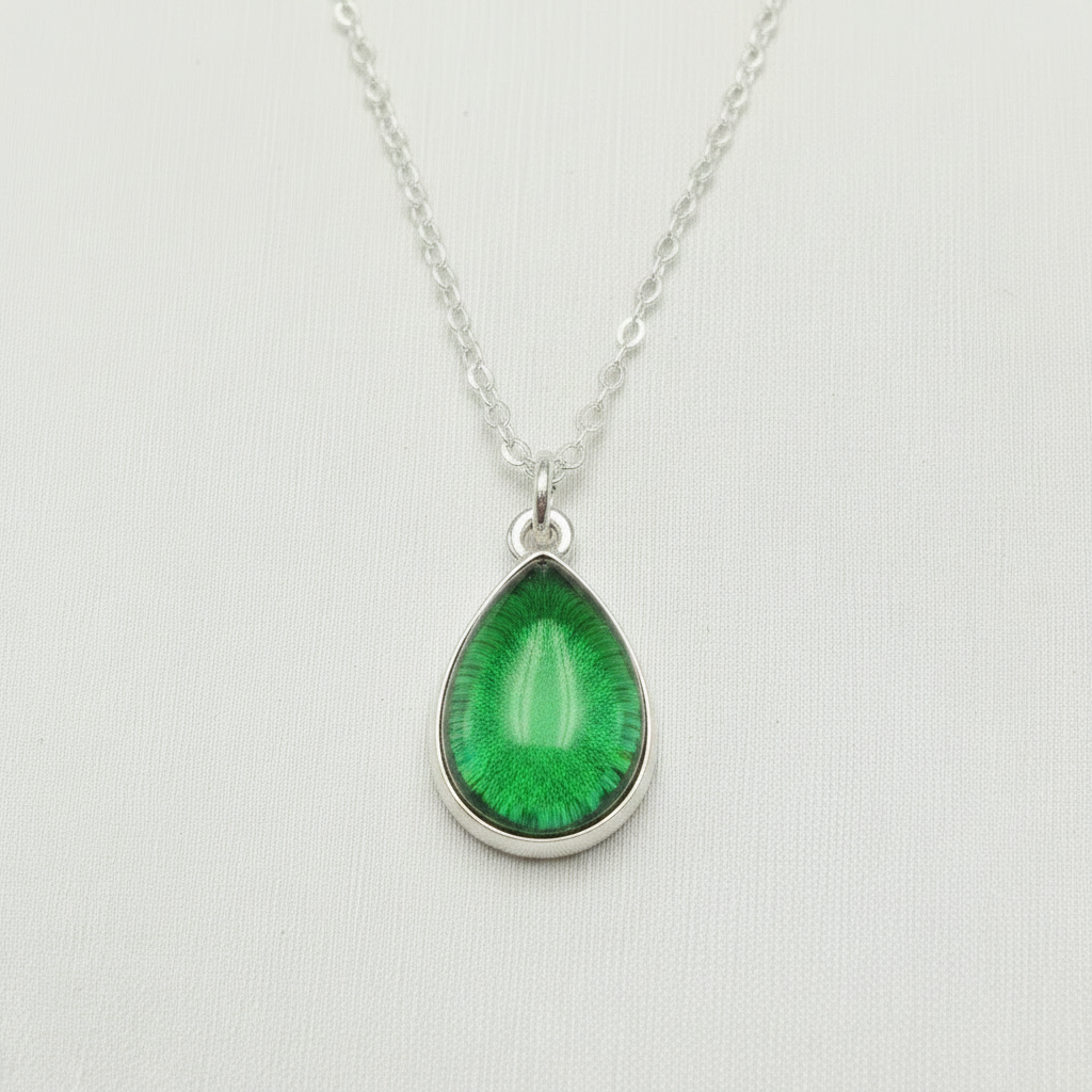 Ashes encased in glass in Handmade Sterling Silver teardrop pendant.