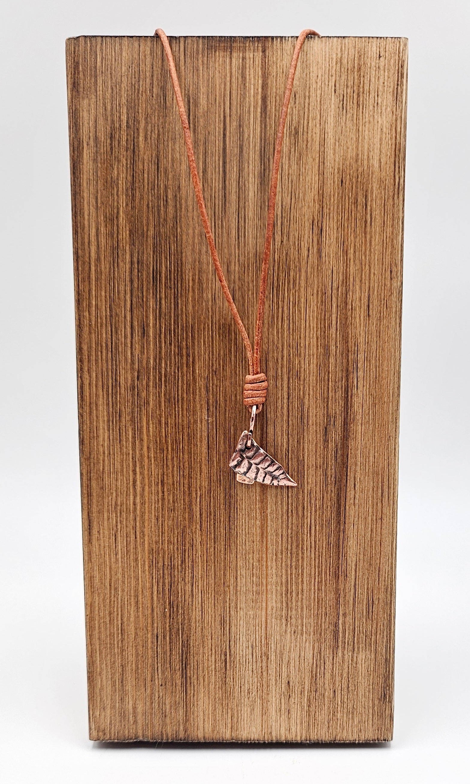 Handmade Copper Bracken Spear Pendant on Tan Leather cord front view