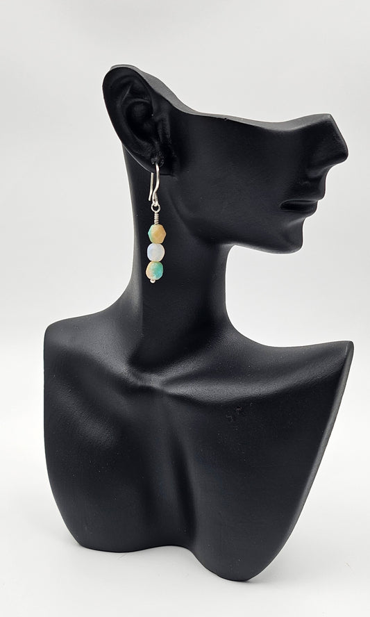 Handmade Copper and Czech Glass Citrus drops on a ceramic head 