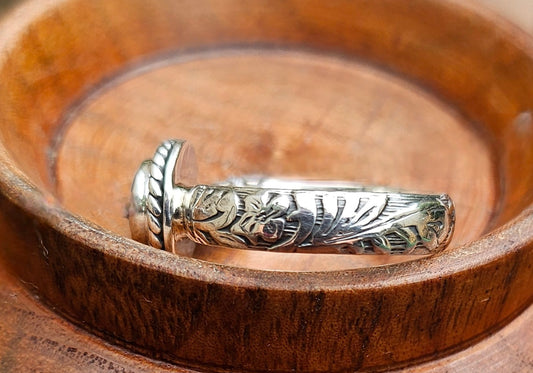 Sterling Silver Bandit's Mine Ring with Floral Band Close-Up against wooden background