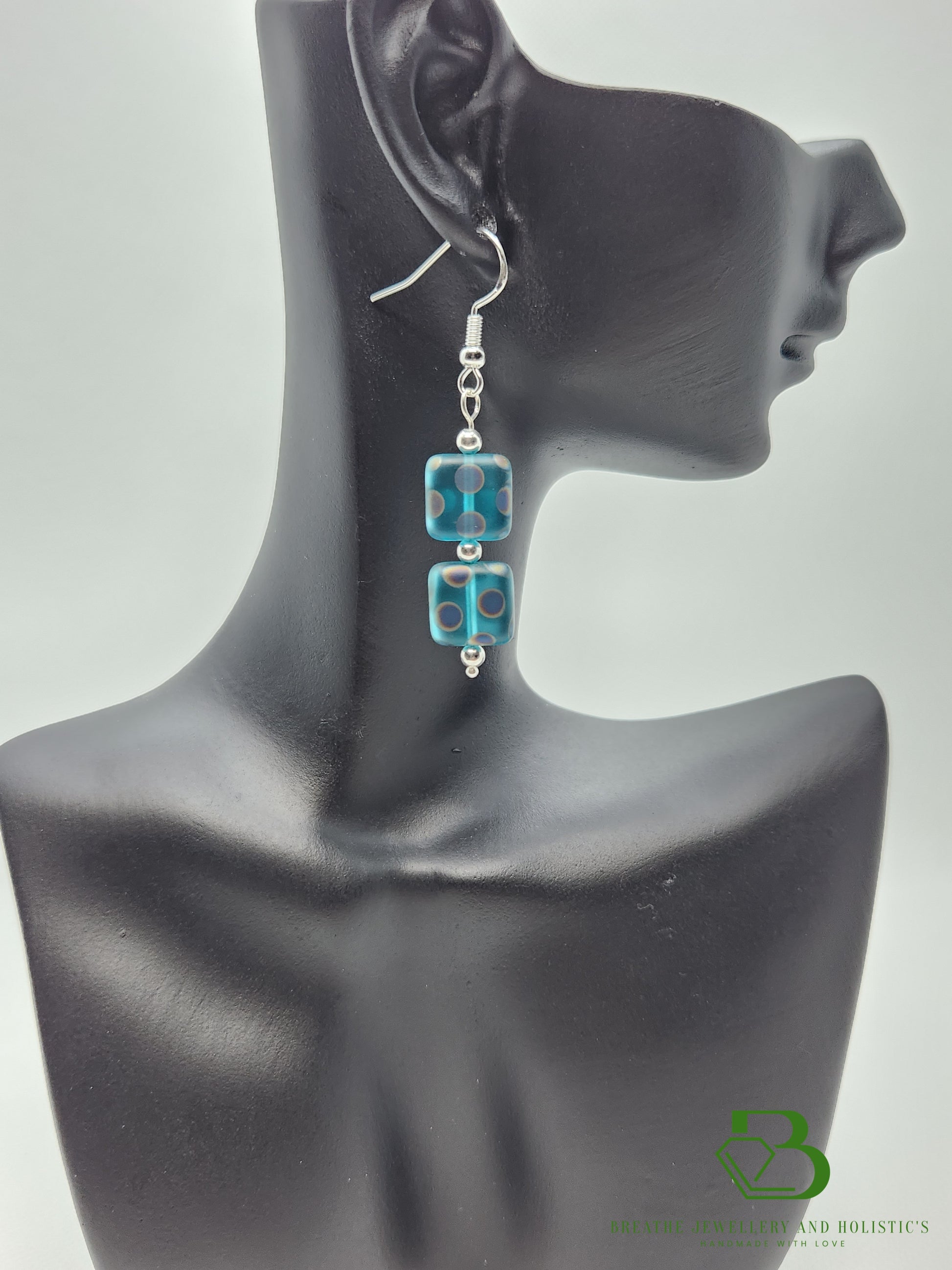 Sterling Silver Peacock Design Earrings on Display