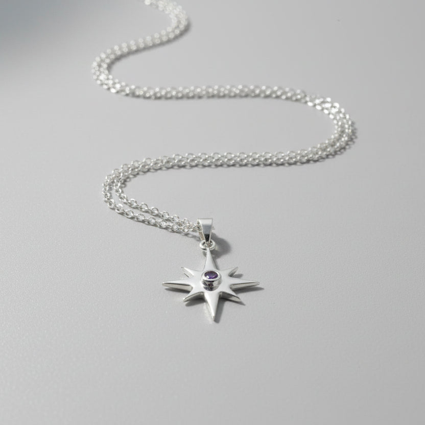 Sterling Silver Star Pendant with Amethyst stone lay flat 