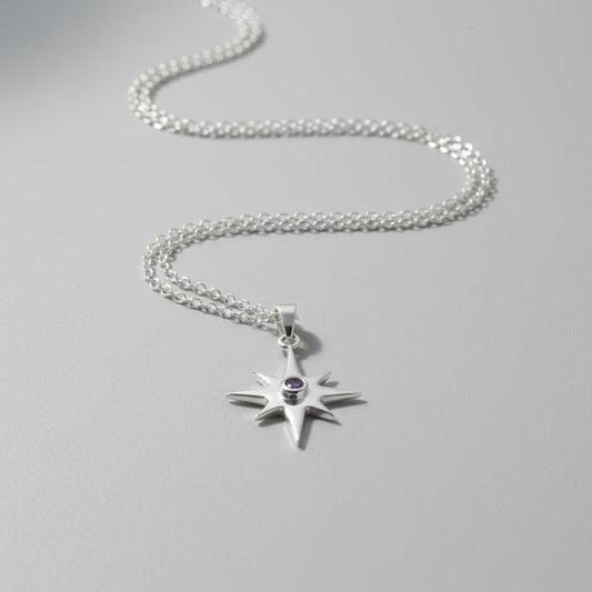 Sterling Silver Star Pendant with Amethyst stone lay flat 
