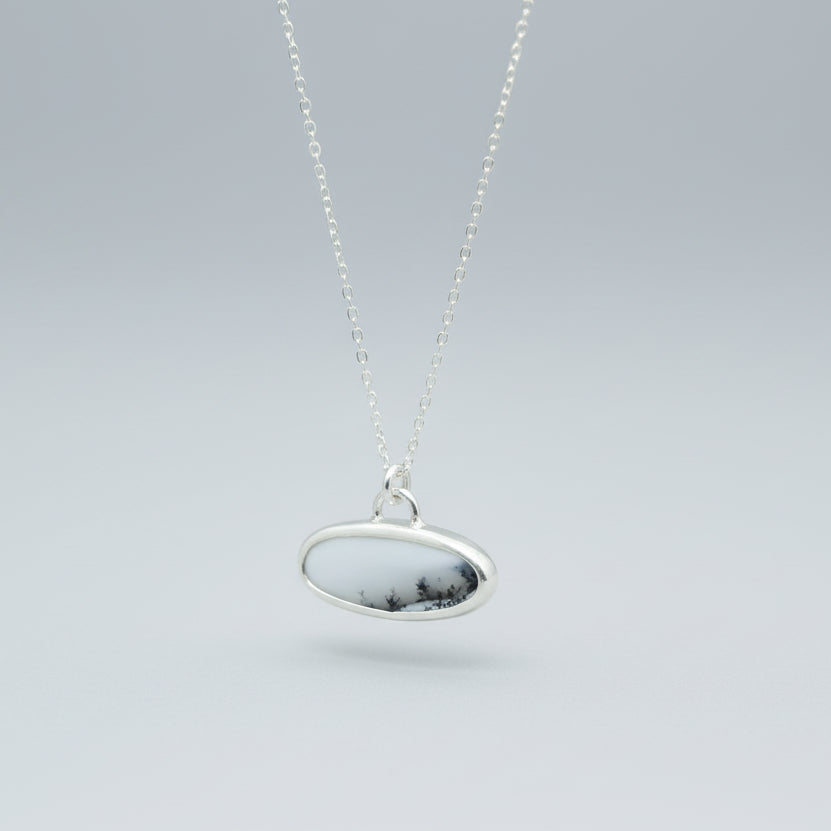 Sterling Silver and Dendritic Opal Oval scenic pendant hanging 