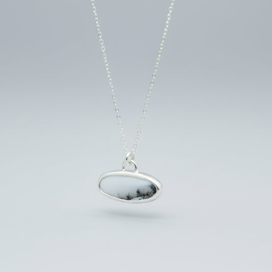 Sterling Silver and Dendritic Opal Oval scenic pendant hanging 