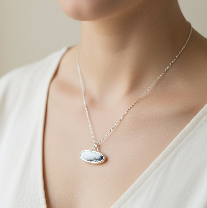 Sterling Silver and Dendritic Opal Oval scenic pendant worn by model 