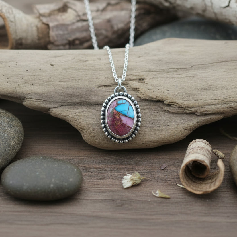 Sterling Silver and Spiny Oyster pendant on driftwood