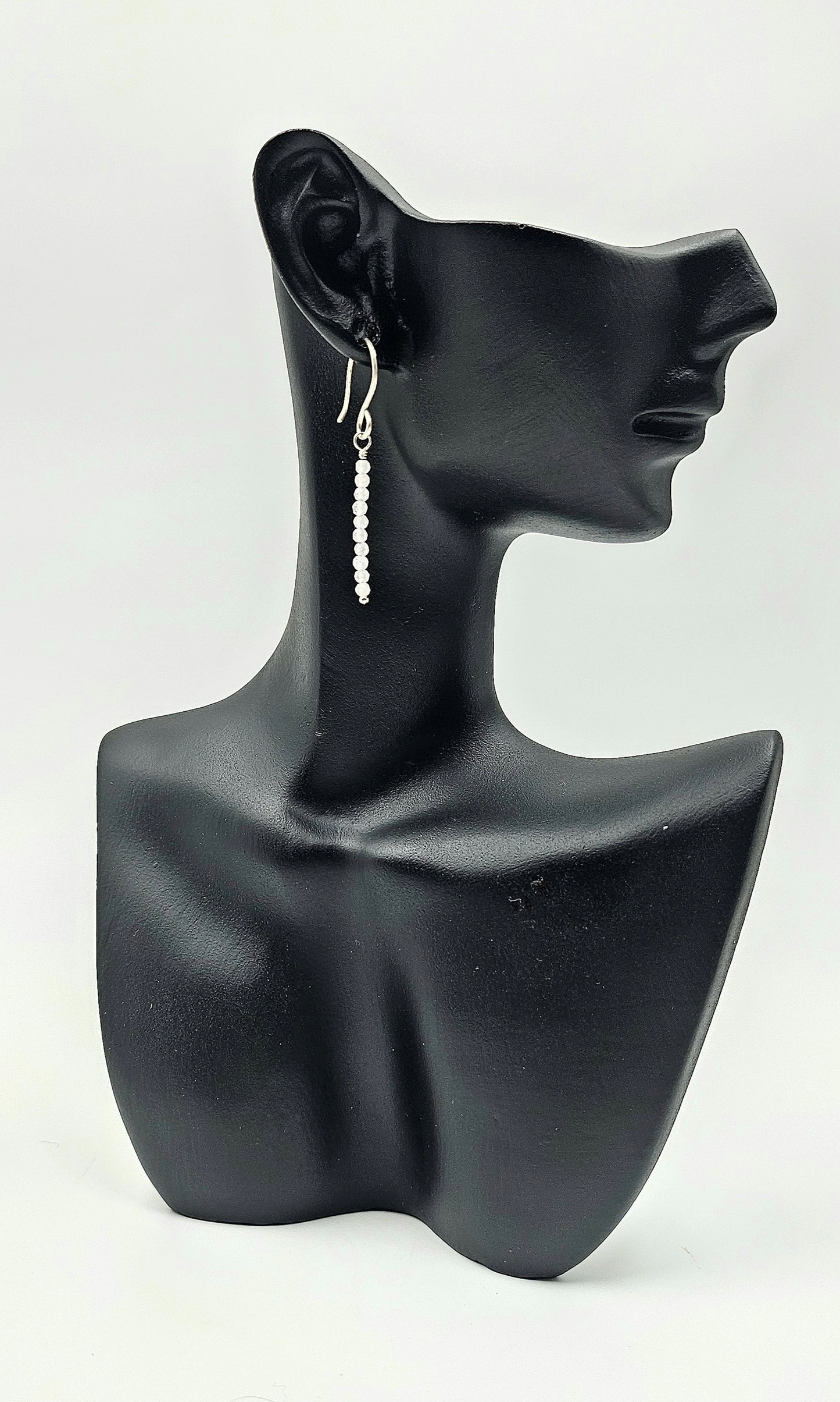 Teeny Tiny Rose Quartz Sterling Silver drop earrings on ceramic head 