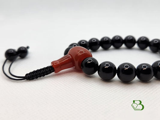 Black and Red Agate Beads Wrist Mala on a white background 