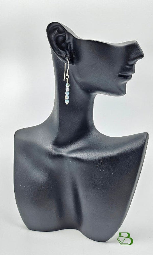 Czech Glass mauve grey drop earrings on a ceramic head 