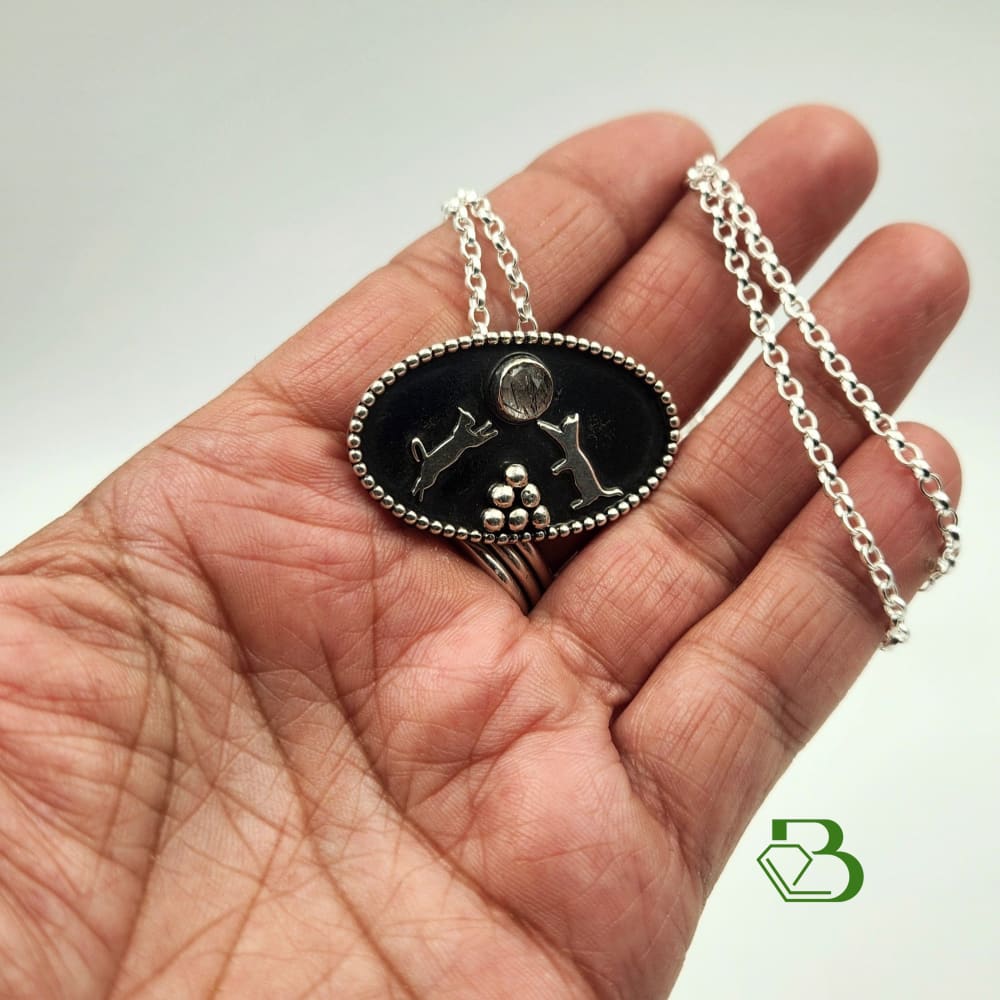 Sterling Silver Playful Cats Pendant With Black Rutilated Quartz - Hand View